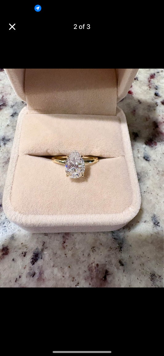 1.5 carat pear cut moissanite ring