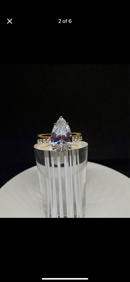 4 carat pear cut ring with wedding band